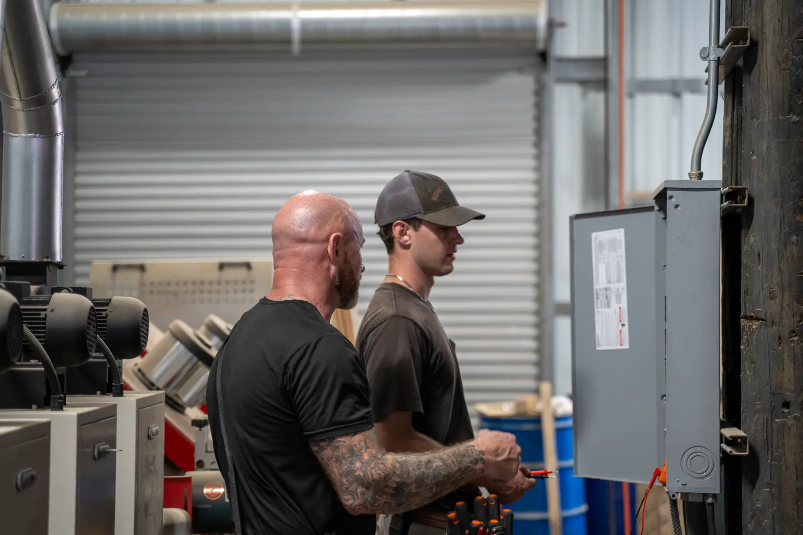 Professionals Electric crew reviewing equipment in the field